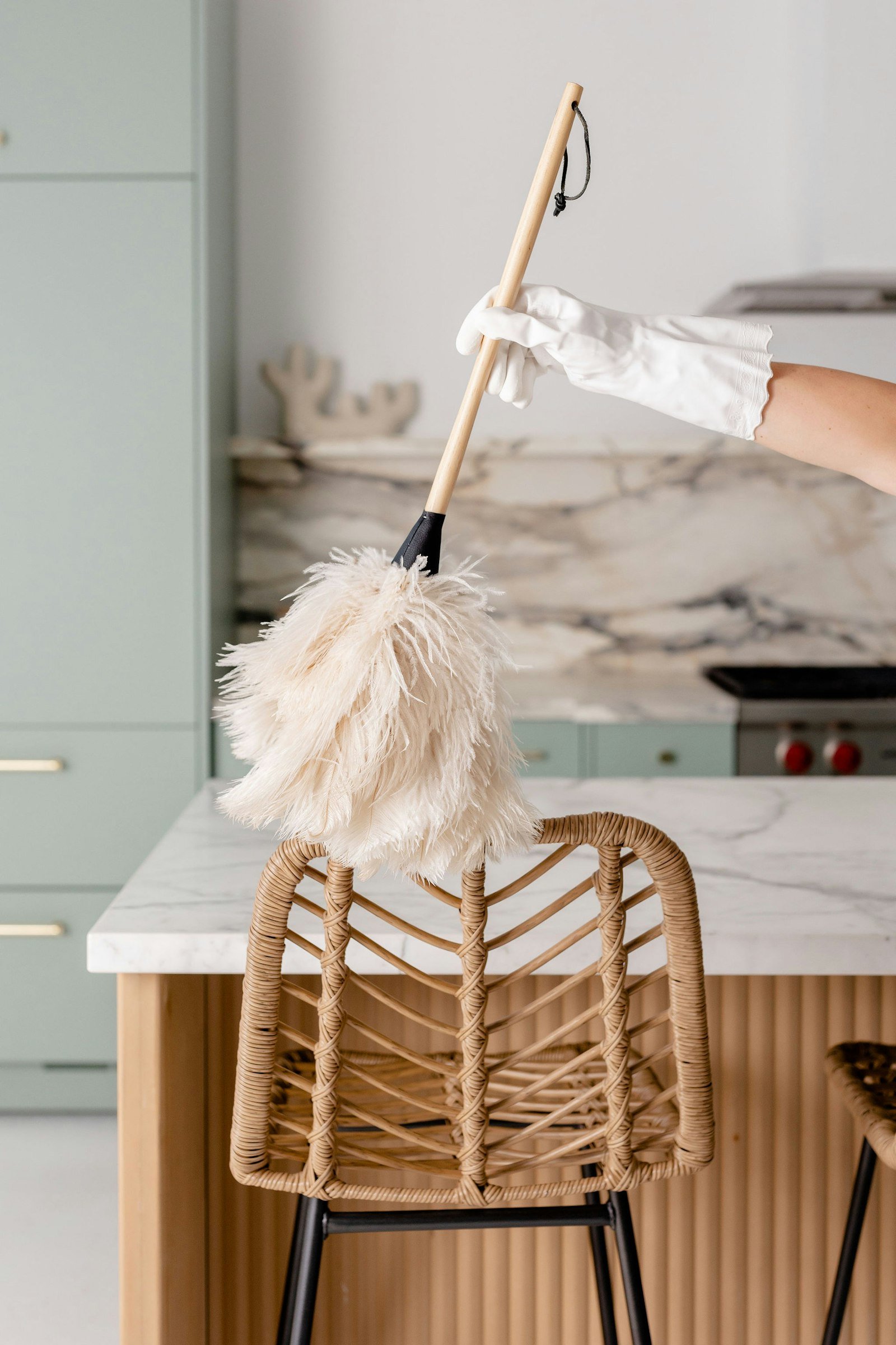 Gloved hands cleaning a chair
